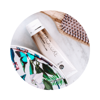 Image of ProLuxe Hair Mask next to a brush.